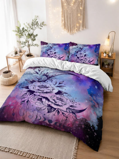 May include: A bedding set featuring a duvet cover and two pillowcases with a galaxy-inspired print in shades of purple, blue, and pink. The design includes a large crescent moon adorned with detailed floral illustrations and star motifs.
