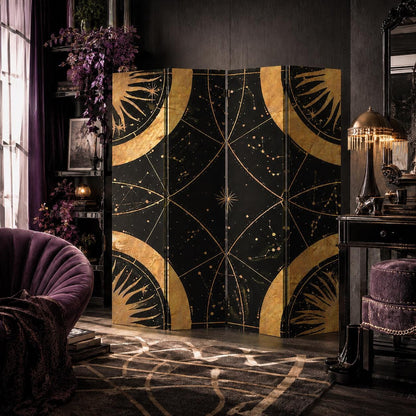 May include: A three-panel folding room divider featuring a black background with gold celestial patterns, including sun motifs and star constellations. The panels are connected by hinges and display a symmetrical design with curved gold accents.
