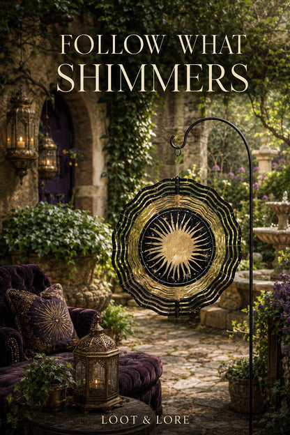 May include: A circular metal wind spinner featuring a gold sun design at the center surrounded by black and gold concentric wavy rings. The text FOLLOW WHAT SHIMMERS is displayed at the top and LOOT &amp; LORE is at the bottom of the image.