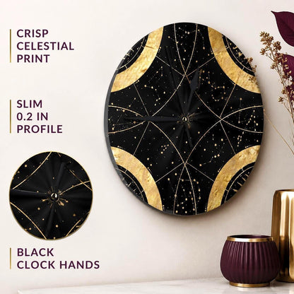 May include: A round wall clock featuring a black background with gold celestial patterns and constellations. The clock has black hands and a slim 0.2 inch profile. Text on the image reads: CRISP CELESTIAL PRINT, SLIM 0.2 IN PROFILE, BLACK CLOCK HANDS.