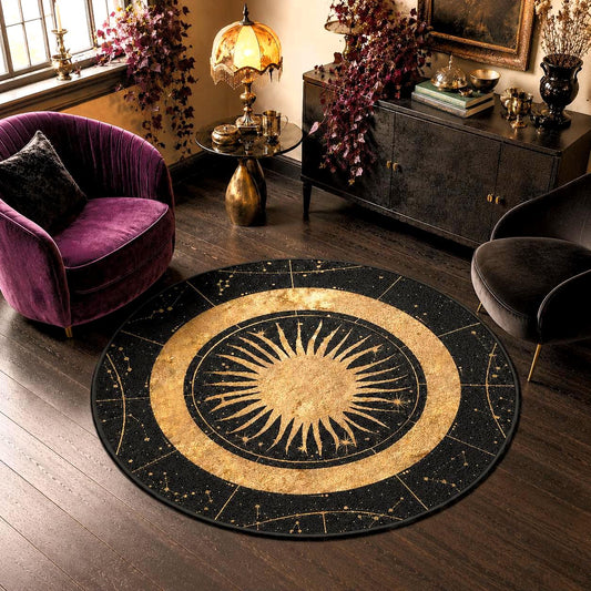 May include: A circular area rug featuring a black background with a gold sun illustration at the center, surrounded by a ring of gold celestial patterns and constellations. The design includes thin gold lines dividing the outer border.