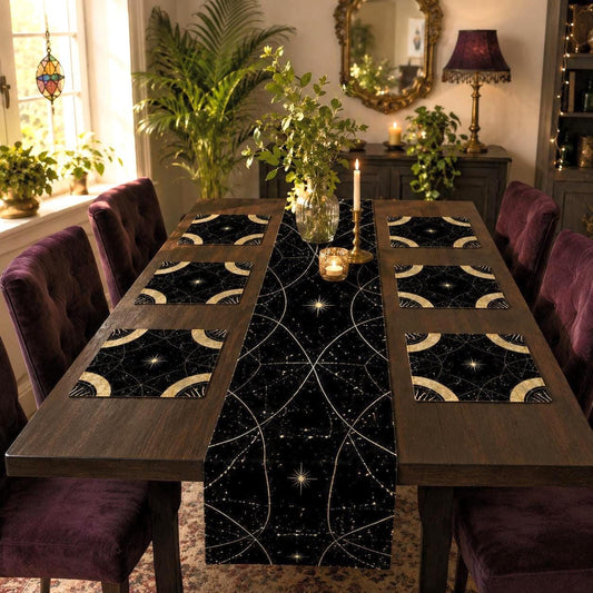 May include: A dark dining table set featuring a long black table runner and six matching square placemats, all decorated with a gold celestial pattern of intersecting arcs, stars, and constellations on a deep black background.