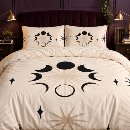 May include: A cream-colored duvet cover and two matching pillowcases featuring a repeating black and beige celestial pattern. The design displays various moon phases arranged in a circular formation, accented by radiating sunburst lines and four-pointed stars.