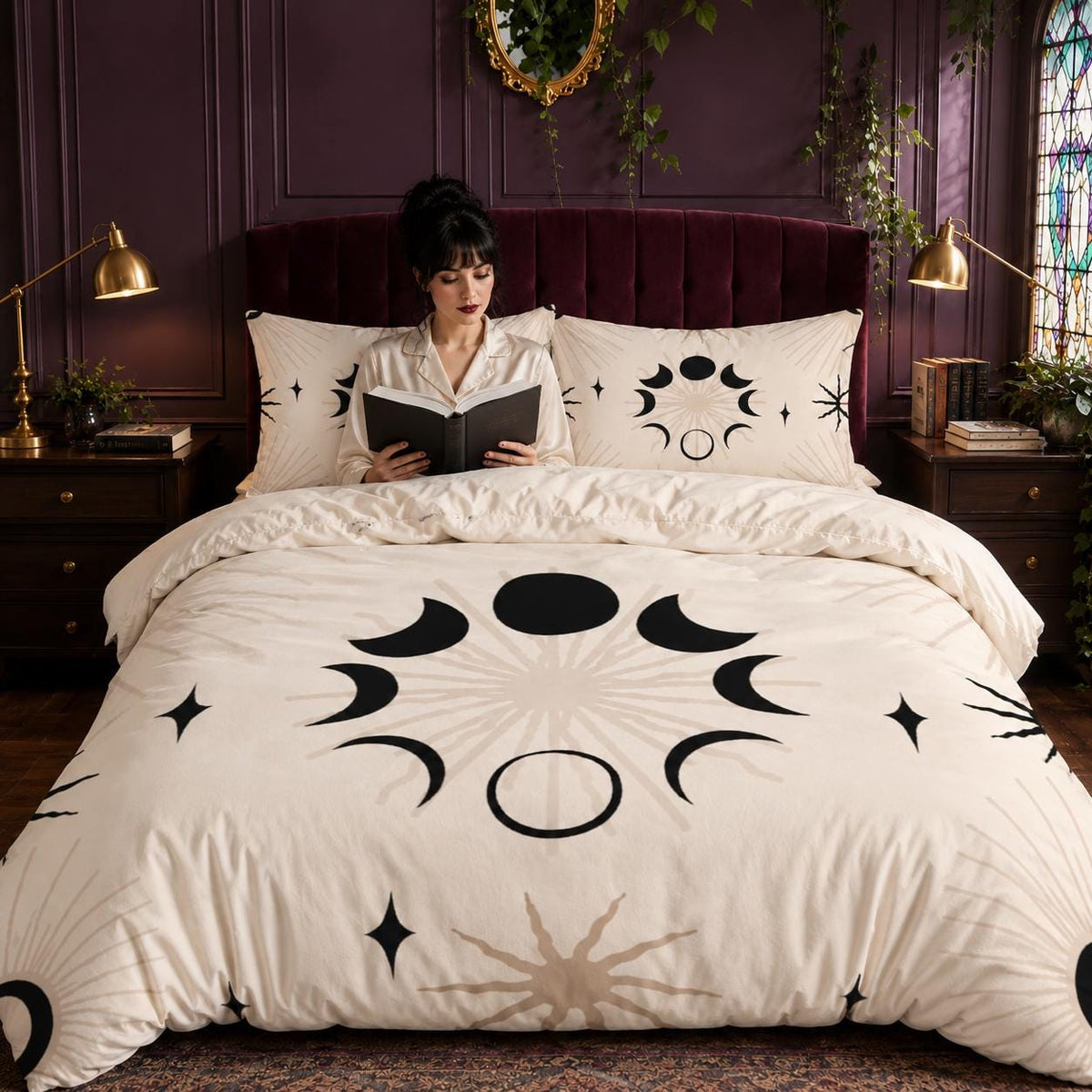 May include: A cream-colored duvet cover and two matching pillowcases featuring a black and beige celestial print. The pattern displays various moon phases arranged in a circular formation, surrounded by radiating sunburst lines and four-pointed stars.